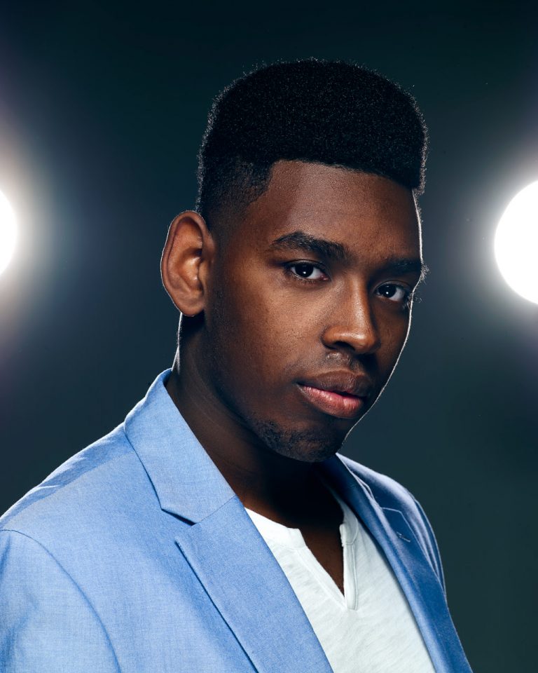 Headshot of Model and Actor Miles in the spotlight on dark background photographed in Alexandria VA by Jared Wolfe